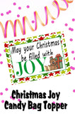 Wish your family and friends a Happy Christmas with this printable to and from tag in the form of a bag topper.  Add some yummy Almond Joys to a bag and top with this bag topper, then add a to and from greeting on the back.  Tie to a present and give as a sweet treat.
