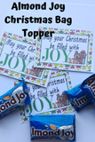Wish your family and friends a joyful Christmas with this printable bag topper.  Add some yummy Almond Joys to a bag and top with this bag topper. This would make a great to and from greeting Tag by adding your info on the back.  Tie to a present and give as a sweet treat.