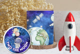 Decorative items including a CD with space-themed design, a rocket model, and a small globe on a surface.