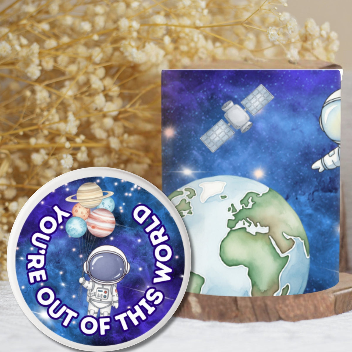 Decorative items including a rocket, a circular sign with text, and a space-themed mug on a surface.