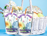 Two Easter-themed tumblers with a basket of Easter eggs and a donut on a blue background.