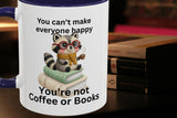 Mug with a raccoon illustration and text about happiness and coffee or books.