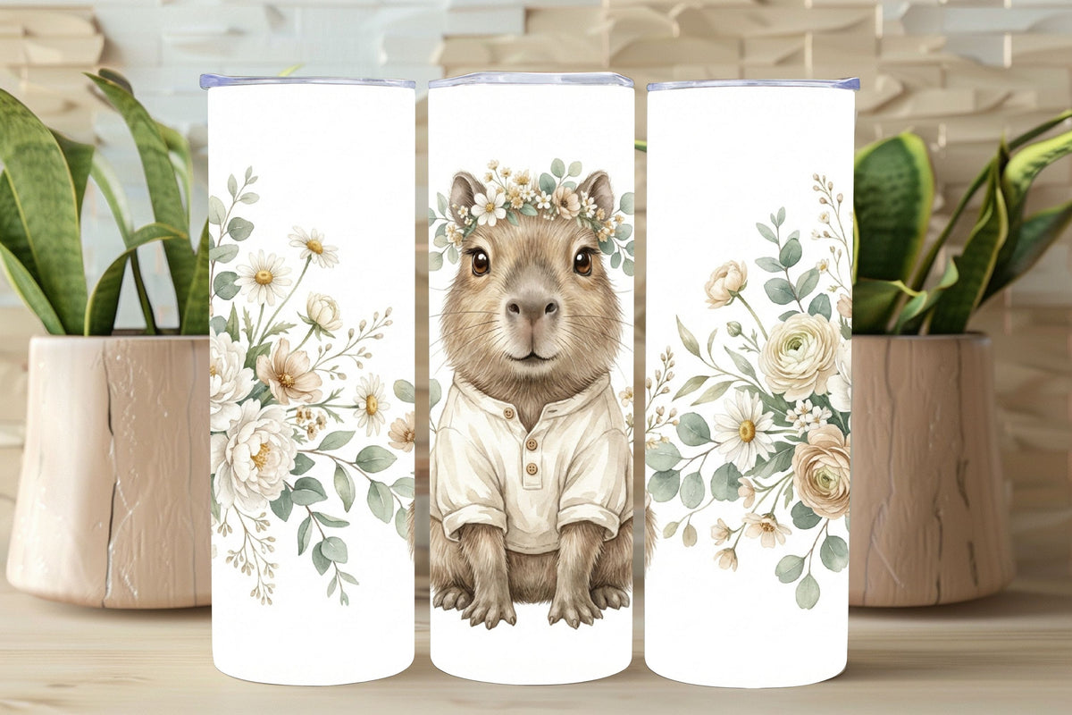 Three tumblers with a squirrel illustration and floral design on a wooden surface.