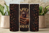 Three dark-themed tumblers with decorative designs and text on a wooden surface.