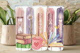 Three phone cases with artistic designs of books, a cup, and candles on a wooden surface.