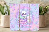 Three colorful tumblers with skull and floral designs on a wooden surface.