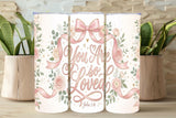 Three tumblers with floral designs and 'You Are So Loved' text on a wooden surface.