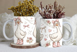 Two mugs with decorative designs of geese, flowers, and bows on a neutral background.