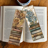Two decorative bookmarks with floral designs on an open book with a cup of coffee.
