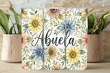 Floral tumblers with 'Abuela' text on a wooden surface with plants.