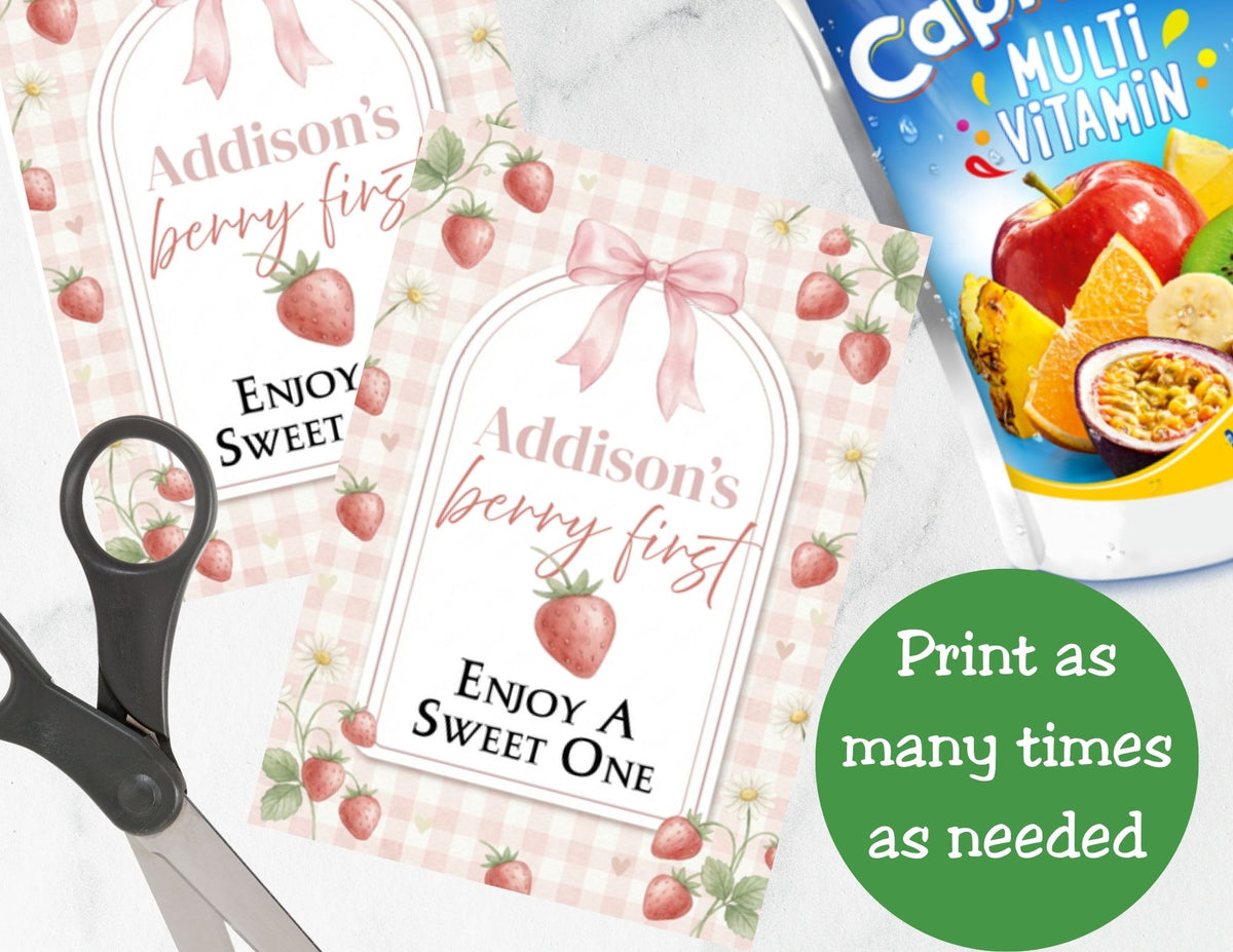 Personalized 'Addison's berry first' labels with strawberries, scissors, and a multivitamin package.