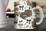 Mug with vintage-style design featuring books, flowers, and other elements on a wooden surface.
