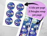 Two sheets of stickers with space-themed designs and text on a gray surface.