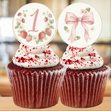 Two red velvet cupcakes with decorative toppers on a blurred background