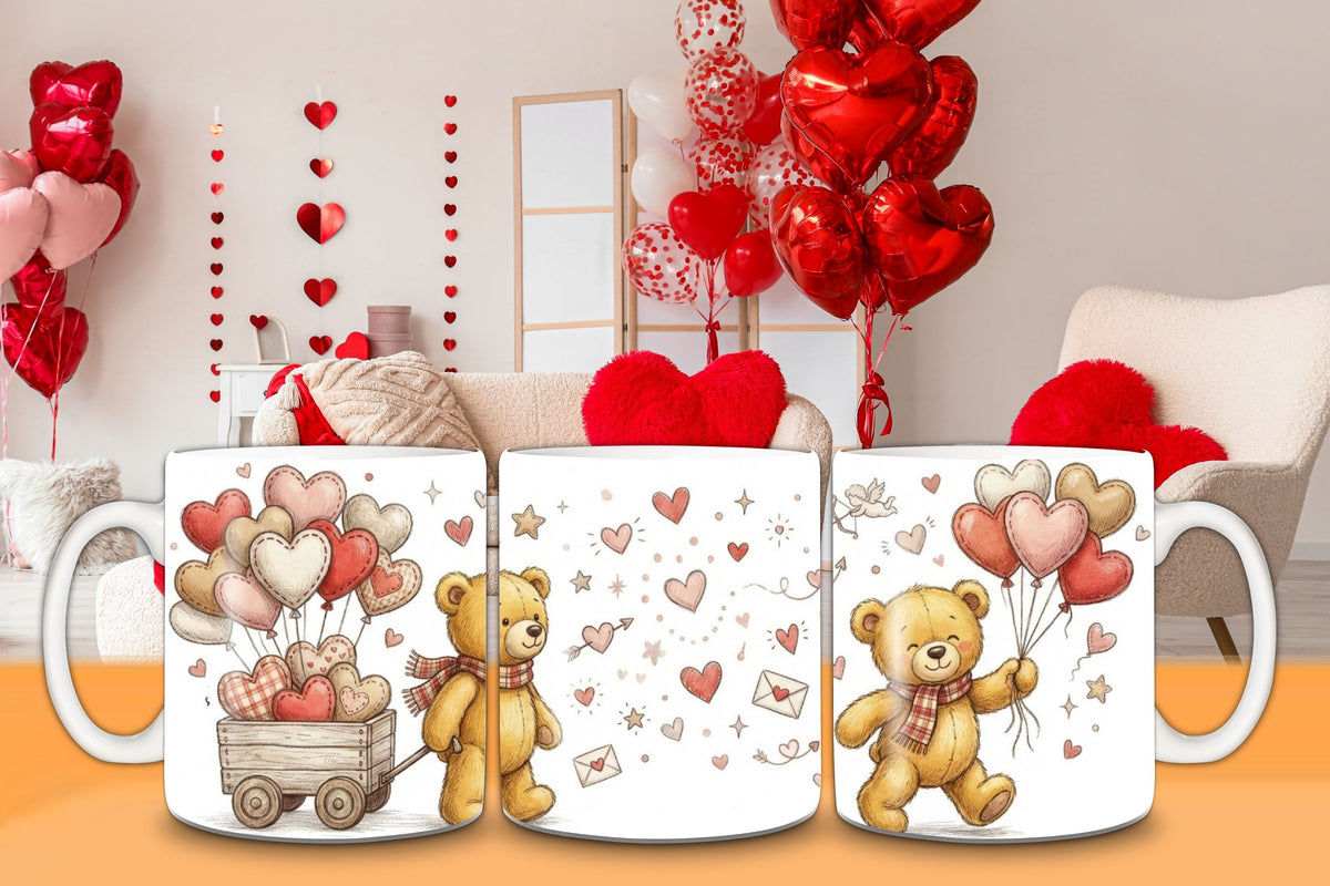 Three mugs with teddy bear and heart designs on a table with balloons in the background.