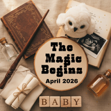 Decorative setup with books, teddy bear, and baby announcement elements on a textured surface.