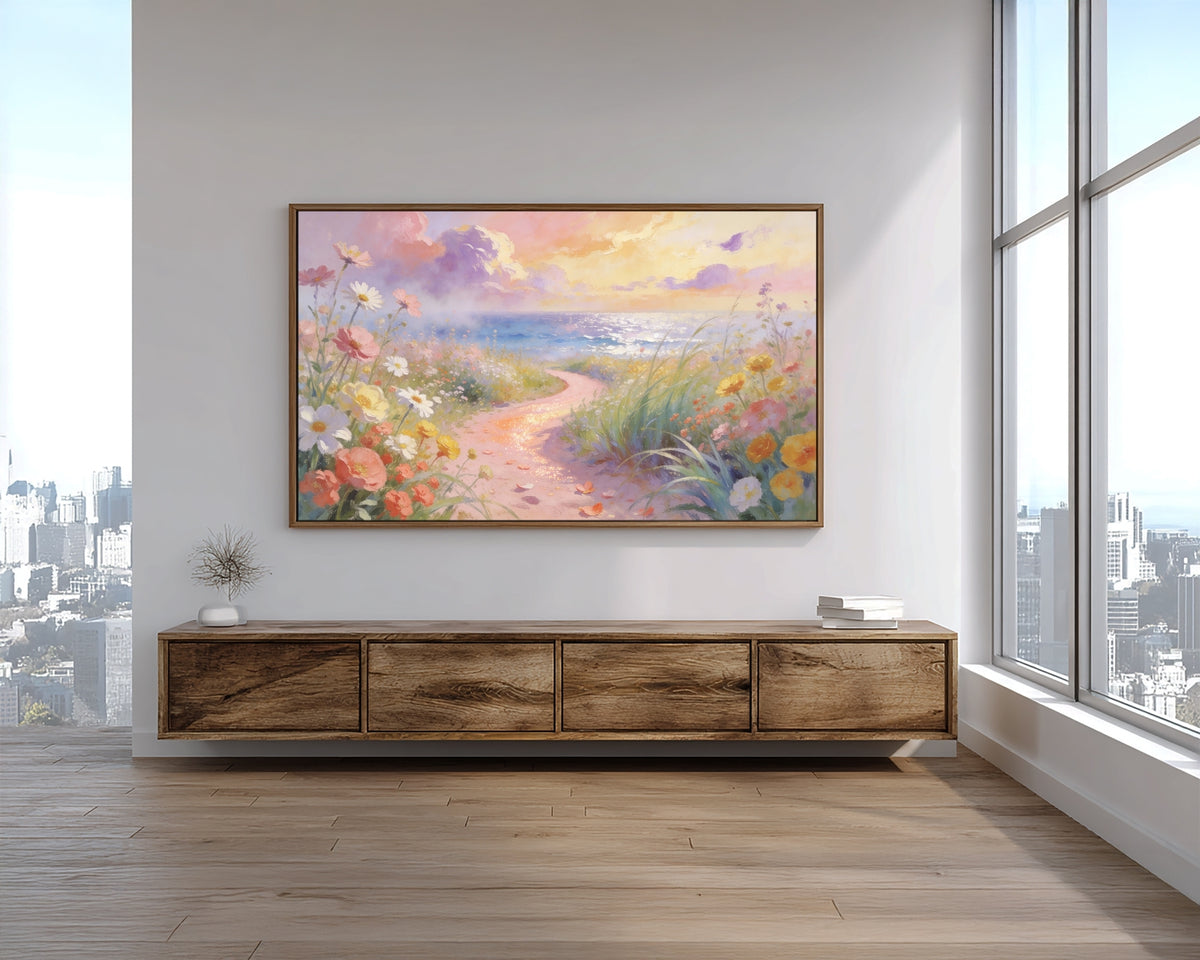 Framed artwork of a floral landscape on a wall above a wooden console table with cityscape view.