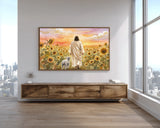 Room interior with a large painting of a man and sheep in a sunflower field on a wall above a wooden console table.