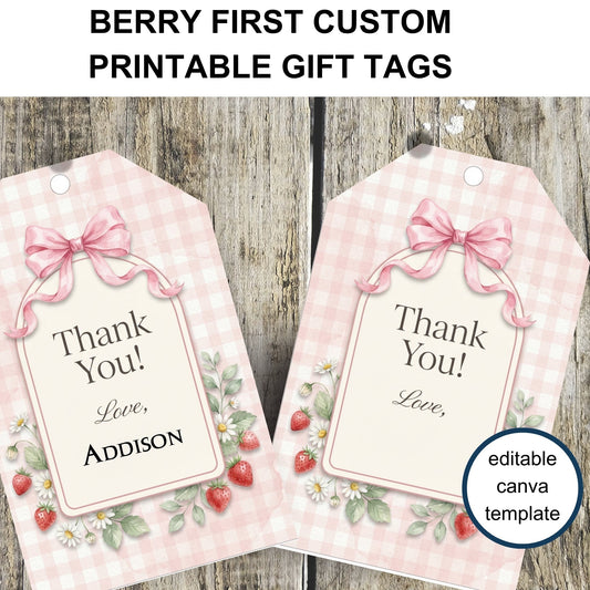 Two pink gift tags with floral designs and 'Thank You!' text on a wooden background.