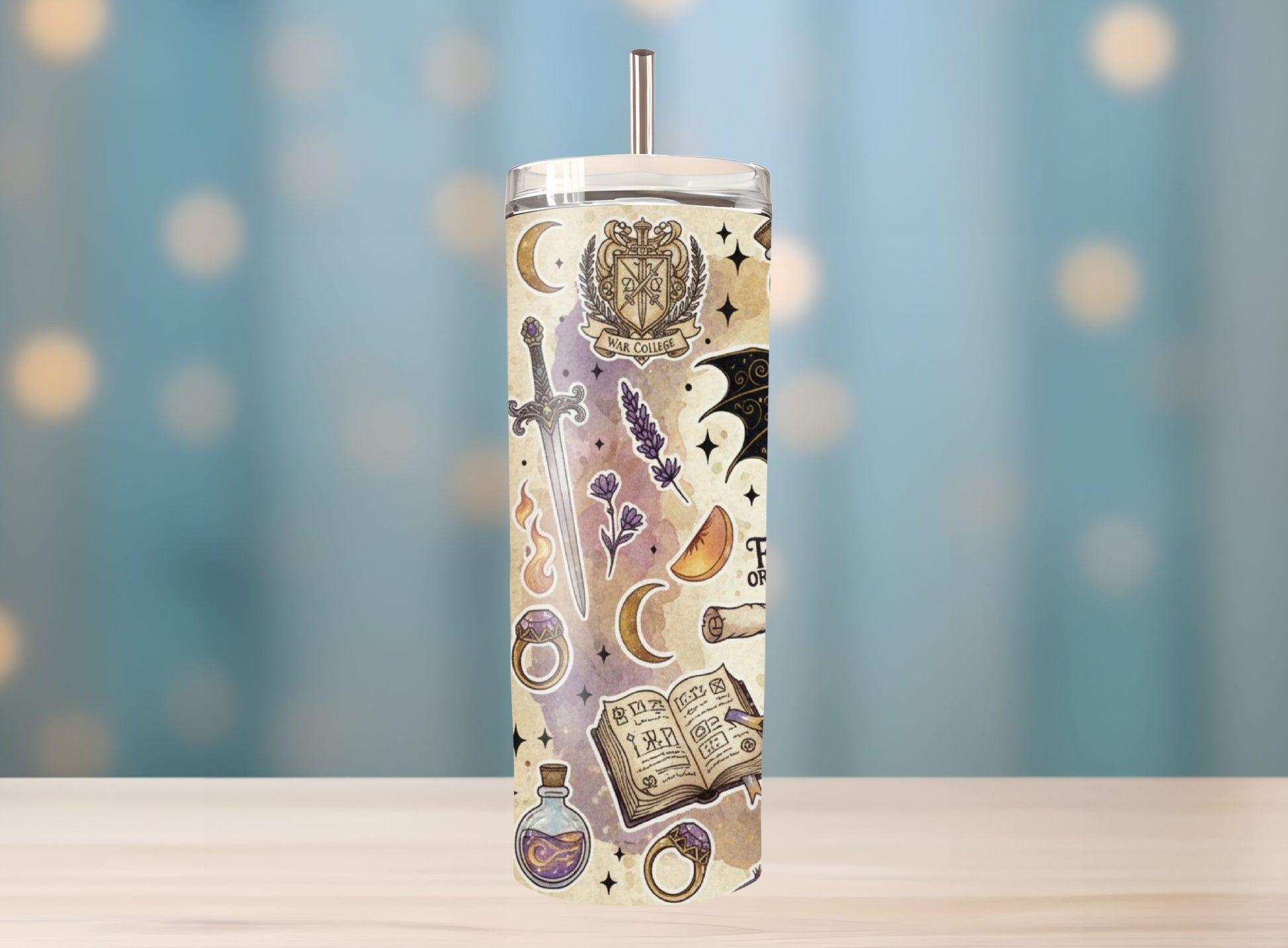 Tumbler with fantasy-themed design on a blurred background