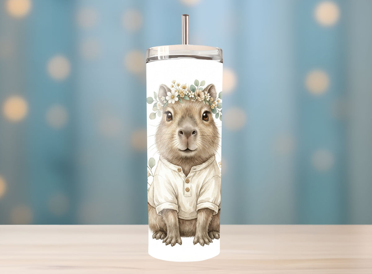 Tumbler with a squirrel design wearing a white shirt and flower crown on a blurred background