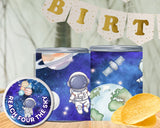 Two cans with space-themed designs and a 'BIRTH' banner in the background.
