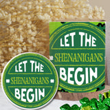 Green and white 'Let the Shenanigans Begin' sign with a container of green candy.