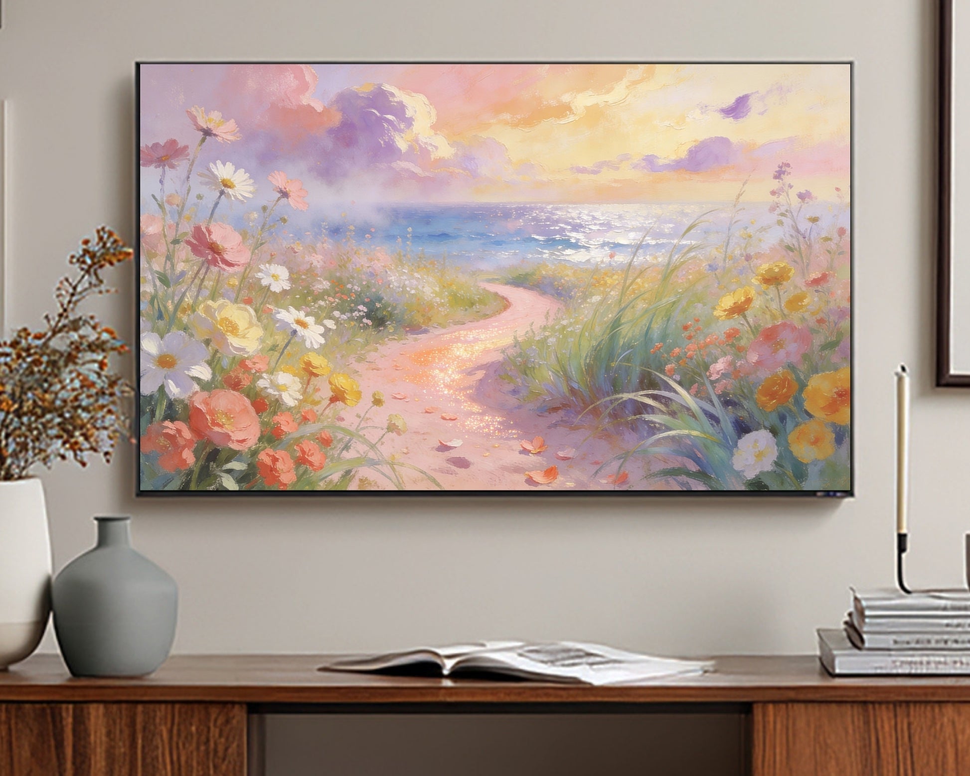 TV displaying a scenic painting of a beach with flowers and a path, placed on a wooden stand.