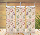 Three knitted curtains with floral patterns hanging on a wooden background