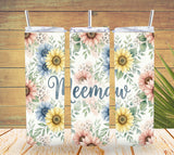 Three floral-patterned tumblers with 'Meemaw' text on a wooden background