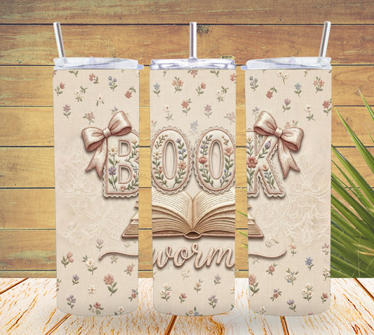 Three tumbler designs with 'bookworm' text and decorative elements on a wooden background.
