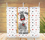 Three tumblers with skull designs and text on a wooden surface