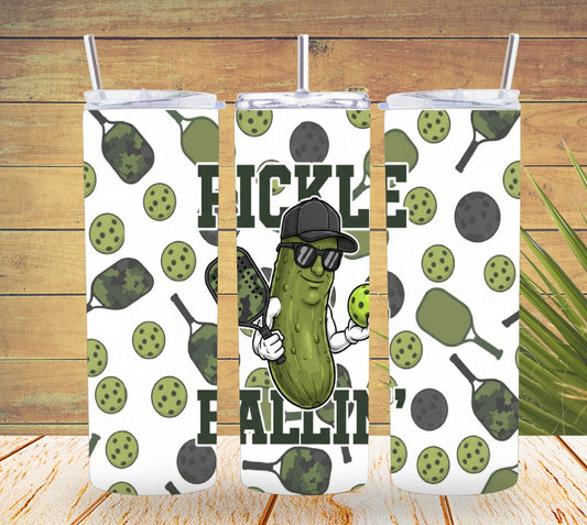 Three pickle-themed tumblers with a character wearing sunglasses and a cap on a wooden background.