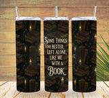 Three tumblers with a book-themed design and text on a wooden background