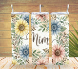 Three floral-themed tumblers with 'Mim' on a wooden background