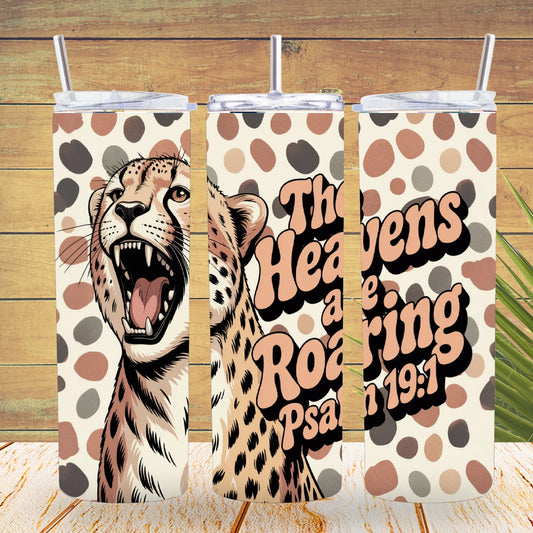 Three tumblers with a cheetah design and text on a wooden background