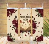 Three tumblers with floral and book design on a wooden surface