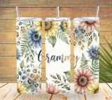 Three floral-themed tumblers with 'Grammy' text on a wooden background