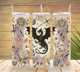 Three tumbler with dragon and fantasy-themed designs on a wooden background