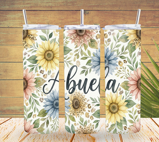 Three floral-themed tumblers with 'Abuela' text on a wooden background