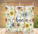 Three floral-themed tumblers with 'Abuela' text on a wooden background