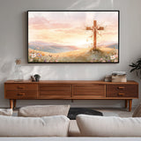 Living room with a wooden TV stand and a large framed artwork of a cross on a hill.