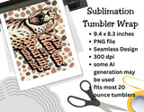 Sublimation tumbler wrap with a leopard design and text, placed on a surface with scissors and tape.