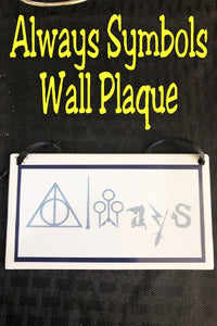 We will Always love the world of Harry Potter and won't hide that love with this fun Harry Potter wall plaque perfect for your home or ofice.  Plaque has a white background with a navy blue border rectangle.  Inside border is the world "Always" with fun Harry Potter symbols from the books and movies.  You'll find the deathly hollows symbol, a magic wand, the Quidditch goals, a wizard, a flying broom, a lightning bolt, and a snake all making up the word Always.