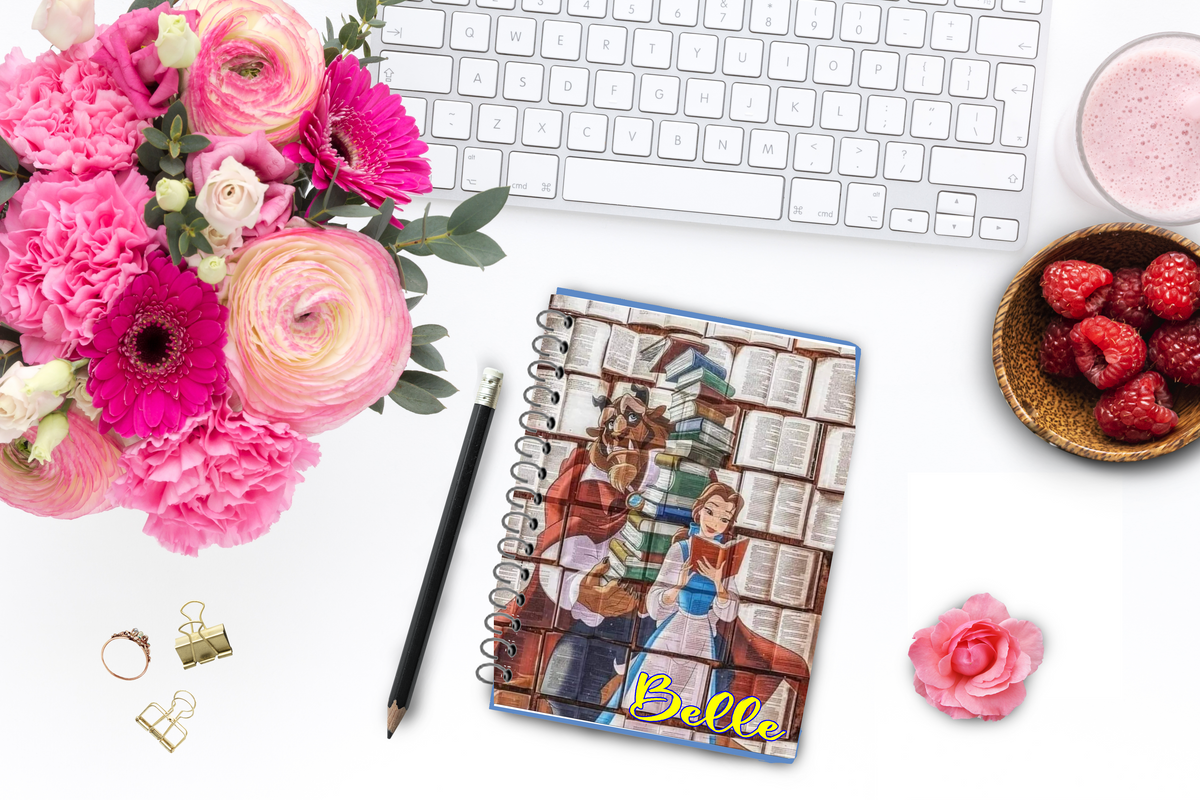 Do you love reading as much as Belle? This personalized notebook and journal is the perfect place for you to record your book thoughts, your TBR, or your plans for each day.  Notebooks has a picture on the front of Belle reading and the Beast behind her holding all her beloved books.  In lower right hand corner is your personalized name in a yellow scrpit font with a slight blue outline.
