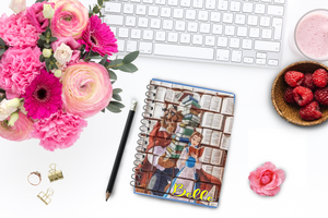 Do you love reading as much as Belle? This personalized notebook and journal is the perfect place for you to record your book thoughts, your TBR, or your plans for each day.  Notebooks has a picture on the front of Belle reading and the Beast behind her holding all her beloved books.  In lower right hand corner is your personalized name in a yellow scrpit font with a slight blue outline.