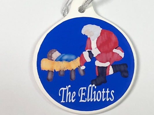 Kneeling Santa Baby Jesus Christmas Ornament